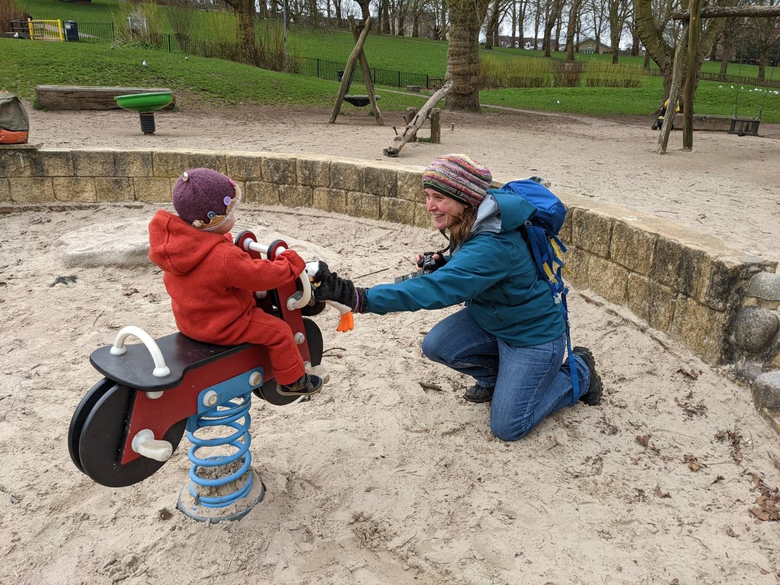 Heike photographing a child at play in a playground